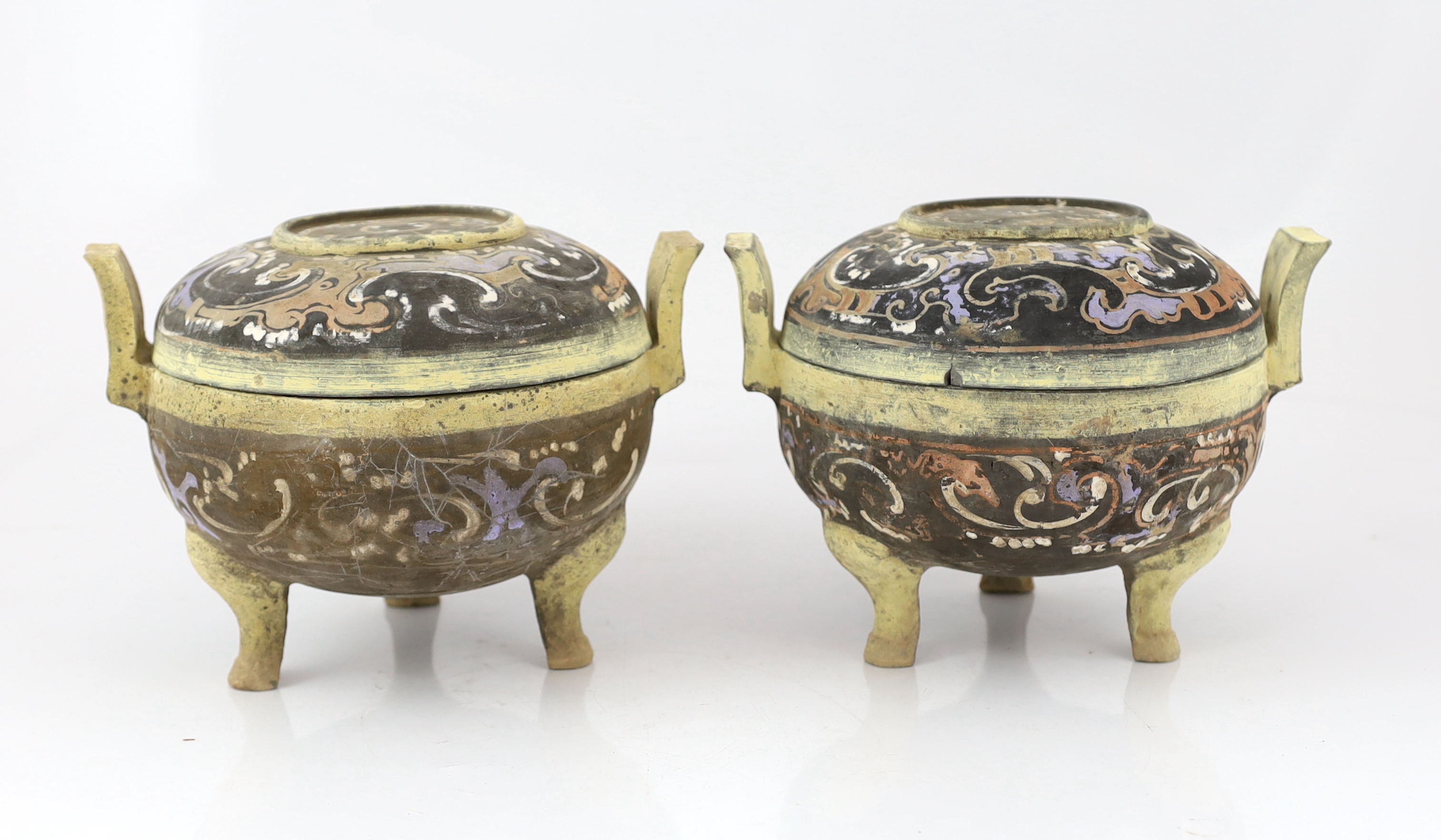 A pair of Chinese polychrome pottery ritual tripod vessels and covers, ding, Han dynasty (202BC - 220AD)